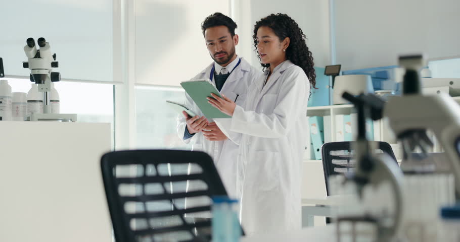 Collaboration, scientist and people with tablet, lab and discussion for medical research and online. Healthcare, man and woman with tech for data analysis, pharmaceutical and teamwork in clinic