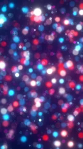 Defocused light particles in red, blue, and white tones floating softly in vertical space. Ambient bokeh animation for digital or festive compositions.