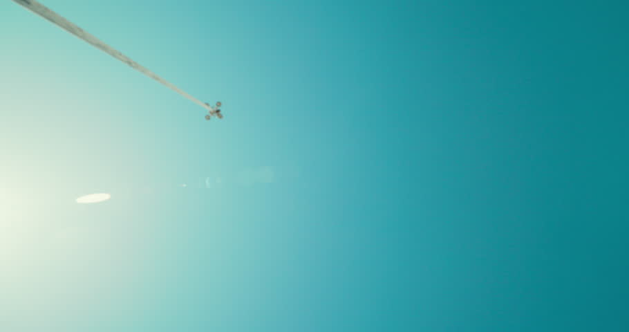 Woman, fitness and jump with blue sky below for running, exercise or athletic sport in nature. Low angle, female person or runner with hurdle in sprint, race or marathon for workout or training
