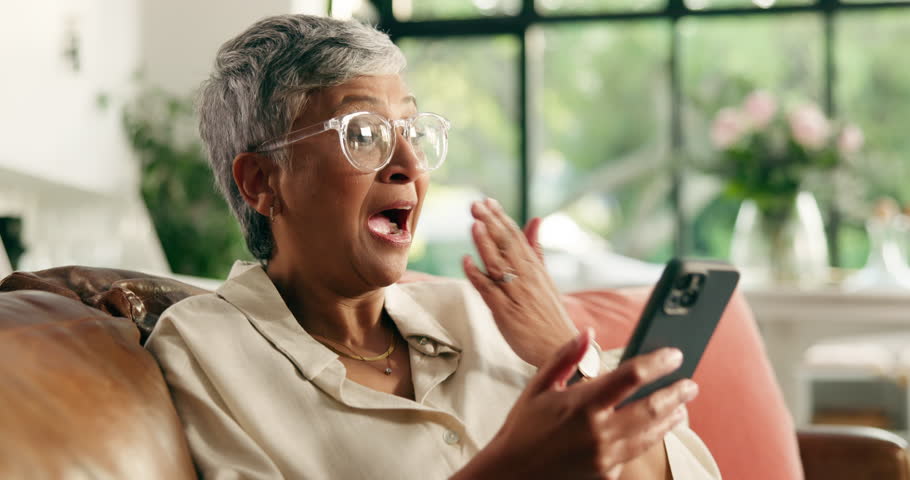Home, excited and old woman on sofa, smartphone and winner with email notification. Apartment, pensioner and senior person on couch, cellphone and celebration with discount deal, competition or sales