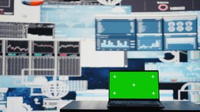 In a business related space, laptop display shows green screen to help with strategy planning with financial data. Representing modern artificial intelligence and productivity for growth. Camera B. - Powered by Shutterstock - Get 15% off with code: PIKWIZARD15