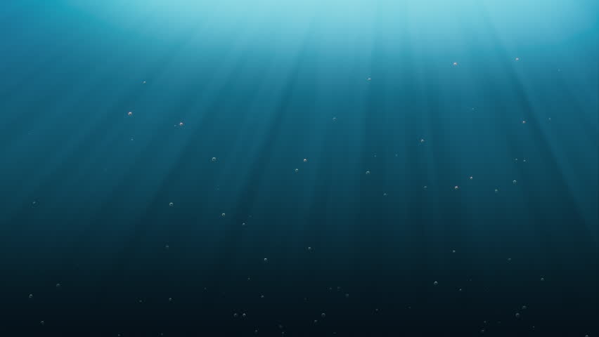 Elegant rays of sunlight shining from above penetrate deep clear blue water.  Small bubbles rising up. Seamless looping 4K animation.