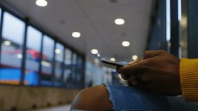 Woman holding smartphone at transit hub spotting digital network node creating expanding avatar web. Connectivity, technology, interface, communication, networking, urban, modern - Powered by Shutterstock - Get 15% off with code: PIKWIZARD15