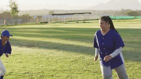 On cue two baseball players shuffling past then jogging cones for training with drifting emojis. Athletic, teamwork, exercise, sport, outdoor, dynamic, performance - Powered by Shutterstock - Get 15% off with code: PIKWIZARD15