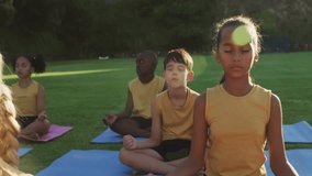 Children practicing yoga in park likes and hearts appearing around showing social media affirmation. Mindfulness, serenity, outdoor, wellness, relaxation, unity, digital culture - Powered by Shutterstock - Get 15% off with code: PIKWIZARD15
