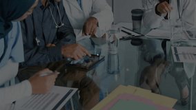 Medical team jotting notes, picking up tablet and activating network nodes on table for analysis. Collaboration, innovation, healthcare, technology, teamwork, data, analysis - Powered by Shutterstock - Get 15% off with code: PIKWIZARD15