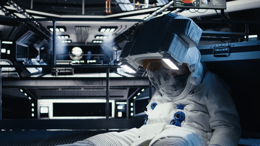 Spaceman collapses after oxygen levels drop suddenly due to spaceship hull breach. Orbital station crew member loses consciousness from environmental failure caused by damaged equipment, camera A