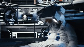 Spaceman collapses after oxygen levels drop suddenly due to spaceship hull breach. Orbital station crew member loses consciousness from environmental failure caused by damaged equipment, camera A - Powered by Shutterstock - Get 15% off with code: PIKWIZARD15