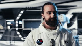 Cheerful astronaut doing videocall with Earth command center while aboard orbit station, sharing mission update. Happy cosmonaut talks with ground center team during communication link, camera B - Powered by Shutterstock - Get 15% off with code: PIKWIZARD15