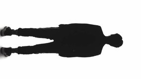 Vertical video. Leader silhouette. Ambition career. Dark contrast back view outline of business man turning head isolated on white. - Powered by Shutterstock - Get 15% off with code: PIKWIZARD15
