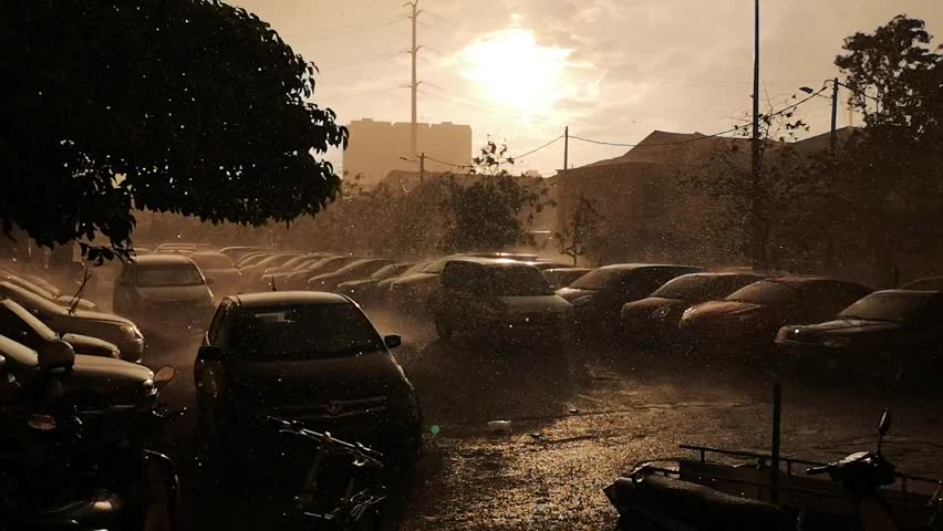 evening rainfall with sun im background