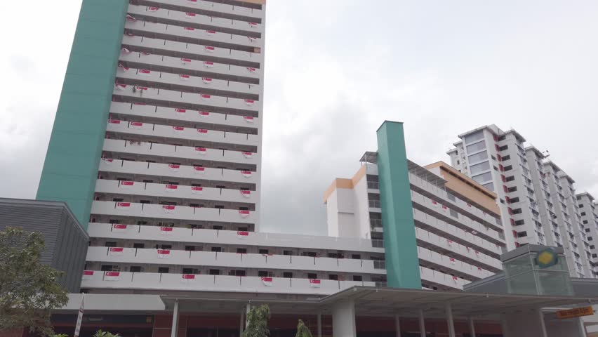 landscape view up to sky view surrounding with highrise office skyscraper building in mega city downtown financial district area of Singapore and white cloud moving against blue sky