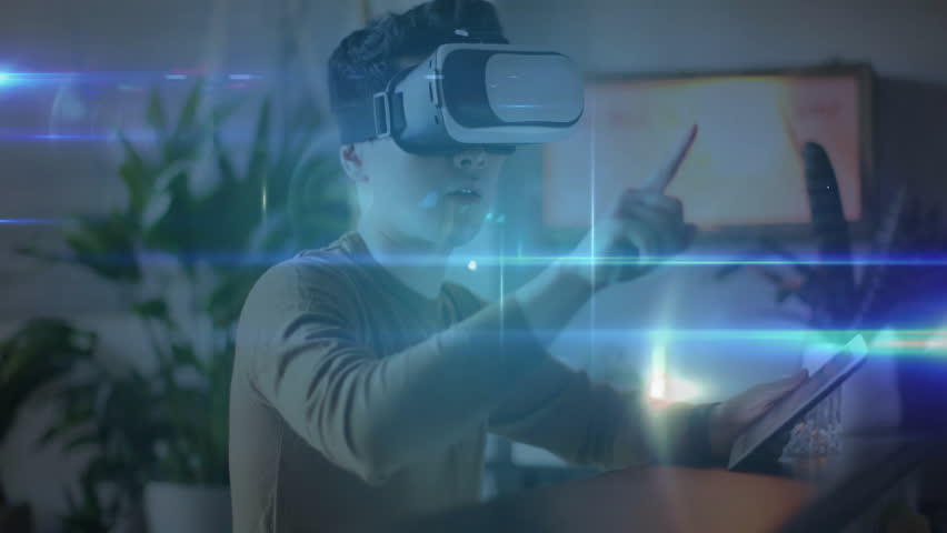 Man wearing VR headset tapping tablet initiating network nodes visualizing data for tech demo. Futuristic, immersive, connection, digital, technology, enterprise, interactive