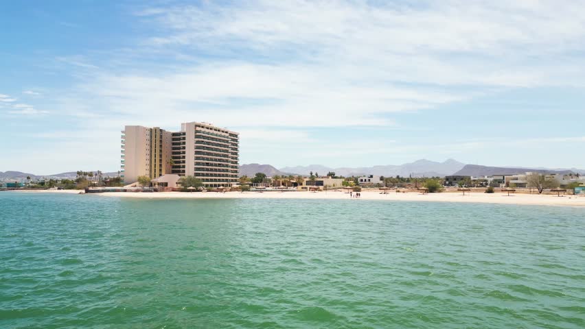La paz beachfront with hotel and clear blue water in baja california sur, aerial view