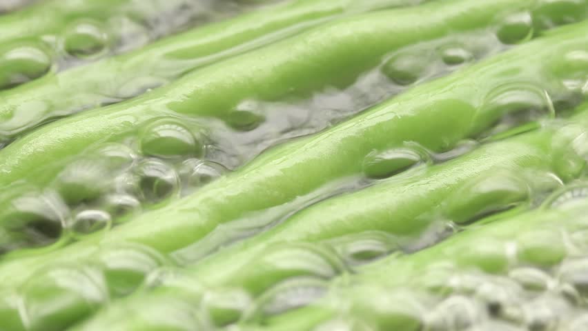 Cooking Snap Bean With Garlic And Black Pepper In Frying Pan. Close-up View