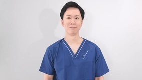 Young Asian male healthcare worker clapping - Powered by Shutterstock - Get 15% off with code: PIKWIZARD15