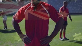 Rugby player lowering gaze on pitch after Australian flag overlay fading in, highlighting focus. Athlete, teamwork, stadium, training, discipline, determination, sport - Powered by Shutterstock - Get 15% off with code: PIKWIZARD15