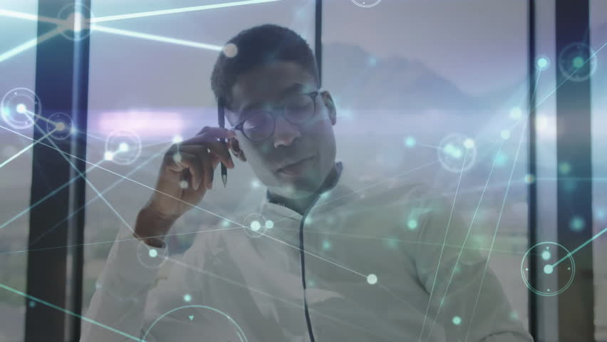 Man adjusting eyeglasses and picking up pen after network graphics appearing for data analysis. Technology, innovation, data visualization, futurism, corporate, professional, digital interface - Powered by Shutterstock - Get 15% off with code: PIKWIZARD15