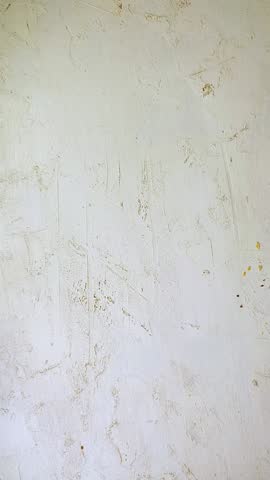 Sliced Turkish delight assortment with cream filling, pistachio, almond, hazelnut, figs and cranberry on the plate. Putting the plate with sweets on the white table. Local name: fistikli fitil lokum