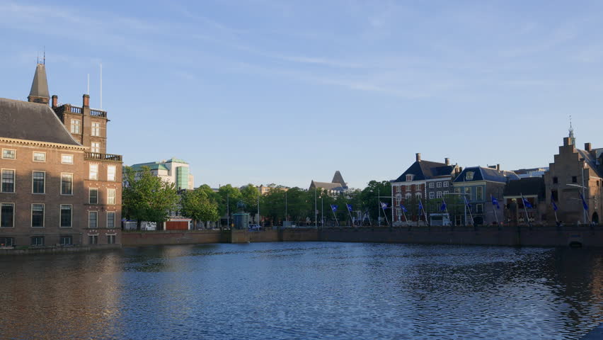 Cityscape of The Dutch Parliament Hofvijver pond at sunset in The Hague, The Netherlands.