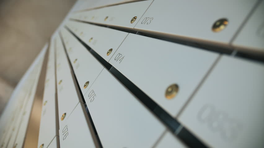 Row of numbered apartment mailboxes