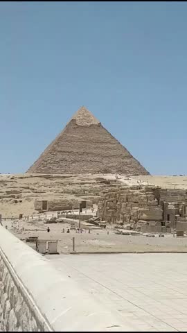 Full HD 1080 Vertical video footage, Archeology reels, Seven Wonders of the World. Great Pyramids of Giza, panoramic 3 Pyramids view, selective focus with shallow depth of field.  Cairo Egypt