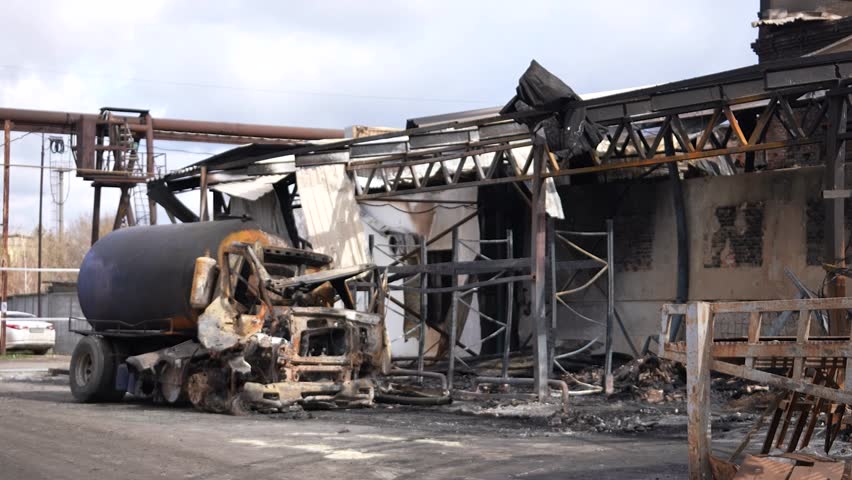Consequences of a house explosion
after a missile strike. Missile strike. Burnt building, Rocket explosion.