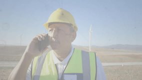 Field engineer pausing smartphone call amid wind turbines, optimizing animated network connections. Technology, connectivity, innovation, automation, power, industry, rural - Powered by Shutterstock - Get 15% off with code: PIKWIZARD15