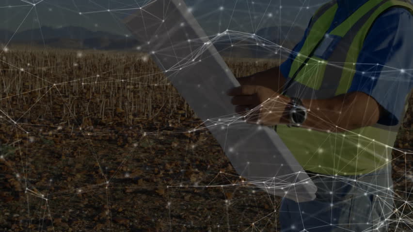 Wind farm engineer catching sunlight on plans and aligning turbine blade orientation inspection. Renewable, sustainability, technology, outdoor, environmental, precision, industrial - Powered by Shutterstock - Get 15% off with code: PIKWIZARD15