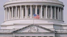US Capitol Dome with American Flag low angle view  - Powered by Shutterstock - Get 15% off with code: PIKWIZARD15