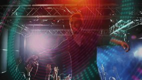 Performer stepping onstage raising arms energizing music fans crowdsurfing under colored beams. Concert, audience, stage, lighting, energy, festival, entertainment - Powered by Shutterstock - Get 15% off with code: PIKWIZARD15
