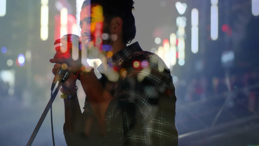 Leaning into mic, street artist singing under neon lights, engaging crowd for music promotion. Performance, nightlife, urban, vibrant, expressive, entertainment, alleyway