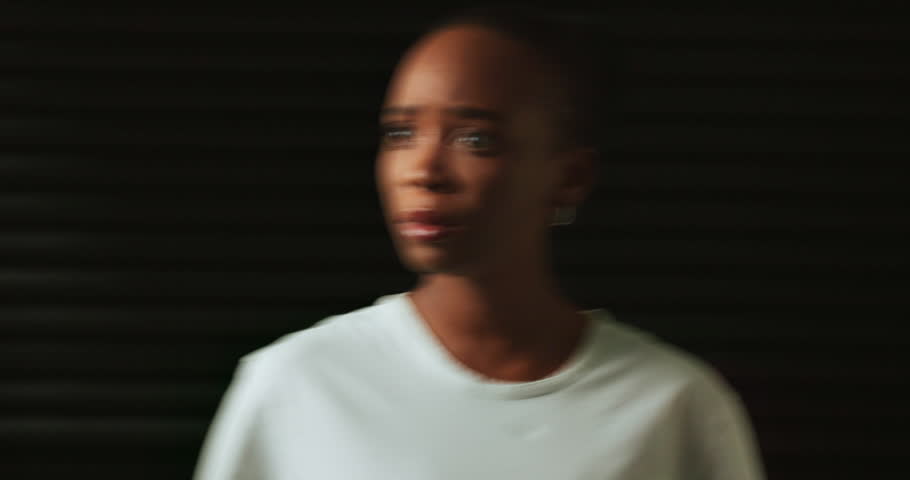 Confused, mental health and woman in studio scared for trauma, emotional abuse and schizophrenia. Psychology, long exposure and person with anxiety, depression and paranoid on black background