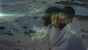 Man wrapping blanket around woman on promenade in media causing nebula overlay glowing silhouettes. Romance, intimacy, couple, connection, twilight, cosmic, ethereal - Powered by Shutterstock - Get 15% off with code: PIKWIZARD15