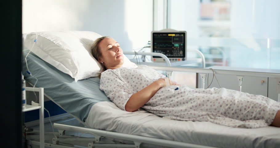 Woman, happy and nurse by hospital bed with tablet, report and listen for good news with healthcare. People, medical professional and patient with touchscreen, feedback or talk with results at clinic