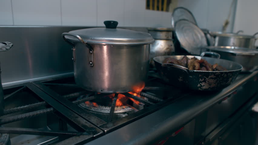 kitchen restaurant fire boiling pot on fireplace gas stove flame