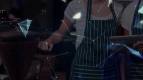 Two coffee shop employees receiving tablet reviewing data while network forming into rotating globe. Collaboration, technology, communication, innovation, teamwork, digital, modern - Powered by Shutterstock - Get 15% off with code: PIKWIZARD15