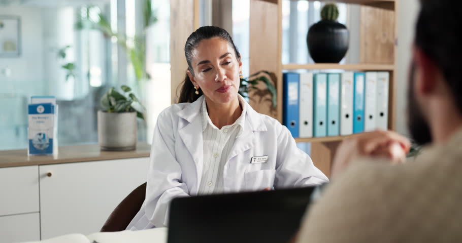 Hospital, laptop and doctor with man in office for appointment, consulting and medical service. Healthcare, talking and person with patient for online results, wellness or diagnosis for treatment