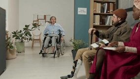 Caucasian social worker with disability asking biracial couple with documents in hands in her office - Powered by Shutterstock - Get 15% off with code: PIKWIZARD15