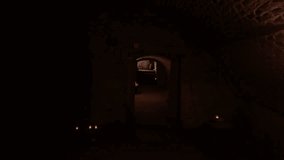 Walking up the stairs from the underground corridors. Cellar corridors lit by candles. The concept of mystery, fear, and danger - Powered by Shutterstock - Get 15% off with code: PIKWIZARD15