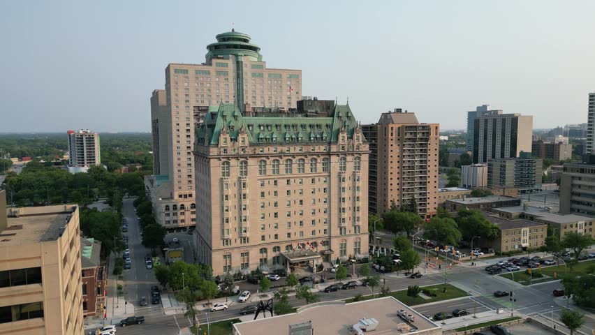 Downtown Winnipeg skyline on summer evening at sunset drone aerial