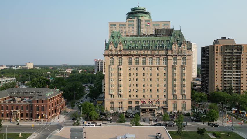 Downtown Winnipeg skyline on summer evening at sunset drone aerial