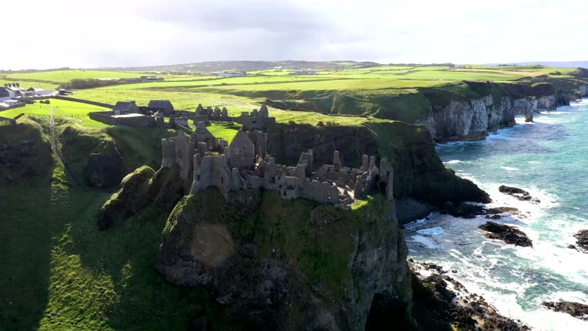High aerial orbit of Dunluce castle on Ireland