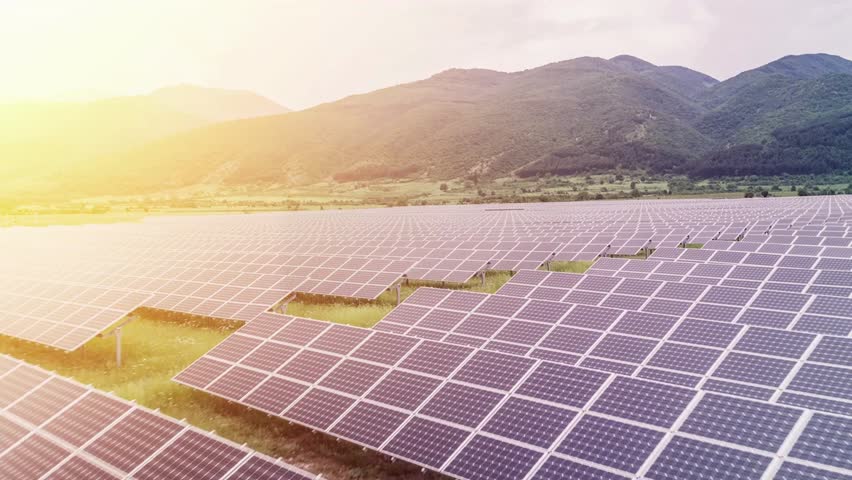 Aerial Flight At Sunset Over Solar Panels Farm Green Energy Conservation Ecology Concept - Powered by Shutterstock - Get 15% off with code: PIKWIZARD15