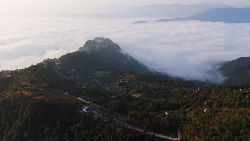 Aerial view overlooking the Gyarjati town and foggy lake Phewa, sunrise in Nepal