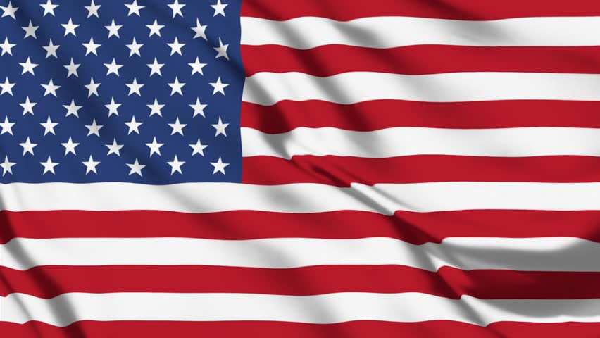 American flag waving patriotically in the wind with red and white stripes. USA flag