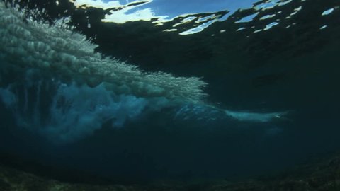 Underwater angle of tropical blue ocean wave  breaking 