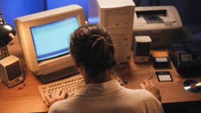Man working and gaming on retro computer PC, IT engineer with vintage computer at home, using old fashion technology, close up of retro setup.  - Powered by Shutterstock - Get 15% off with code: PIKWIZARD15