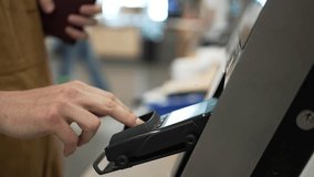 Close-up of a customer inserting a credit card into a pos terminal and typing the pin code, completing a purchase transaction in a retail store - Powered by Shutterstock - Get 15% off with code: PIKWIZARD15