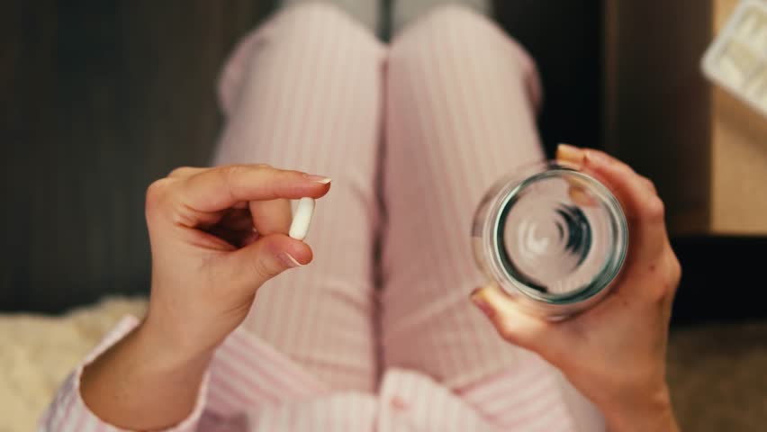 Pills and vitamins macro, Close up view of womans hands holding plenty of different drugs. Painkillers and antibiotics. Healthcare and medicine concept